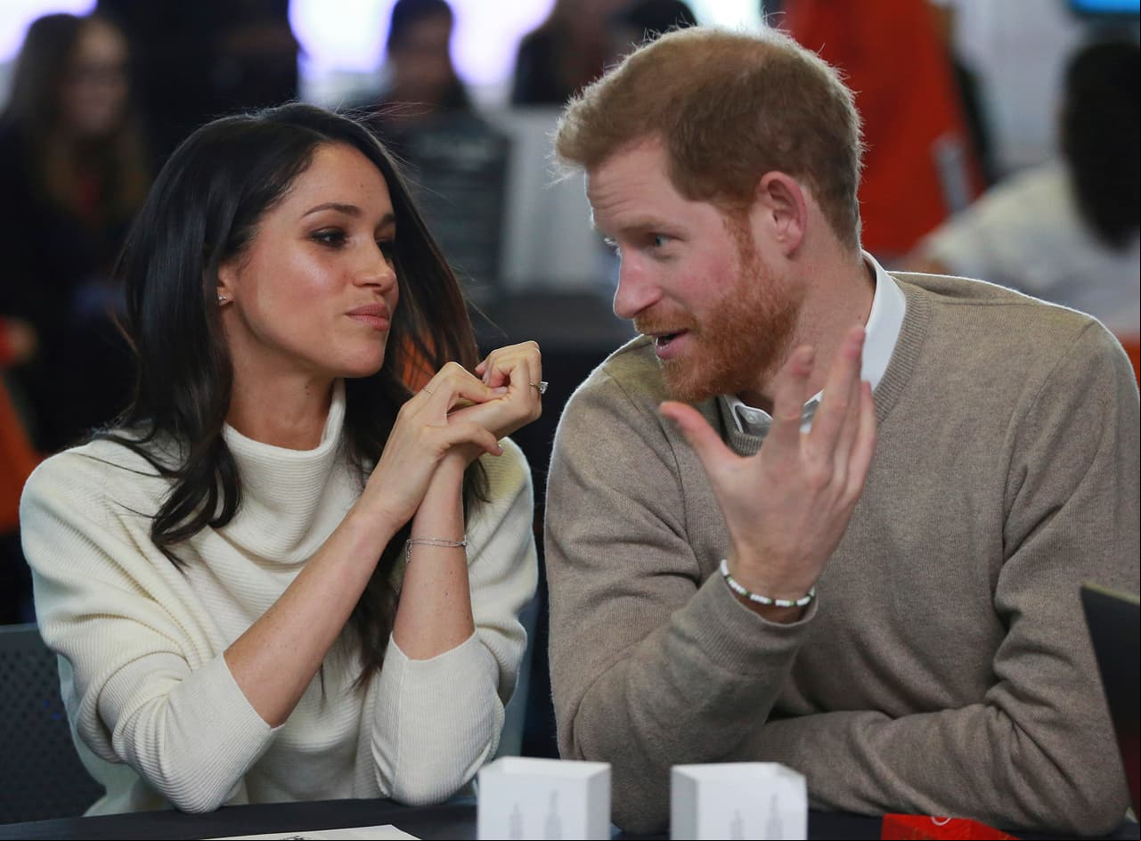 Britain's Prince Harry and Meghan Markle take part in an event as part of International Women's Day in Birmingham, central England, Thursday, March 8, 2018. (Ian Vogler/Pool via AP)