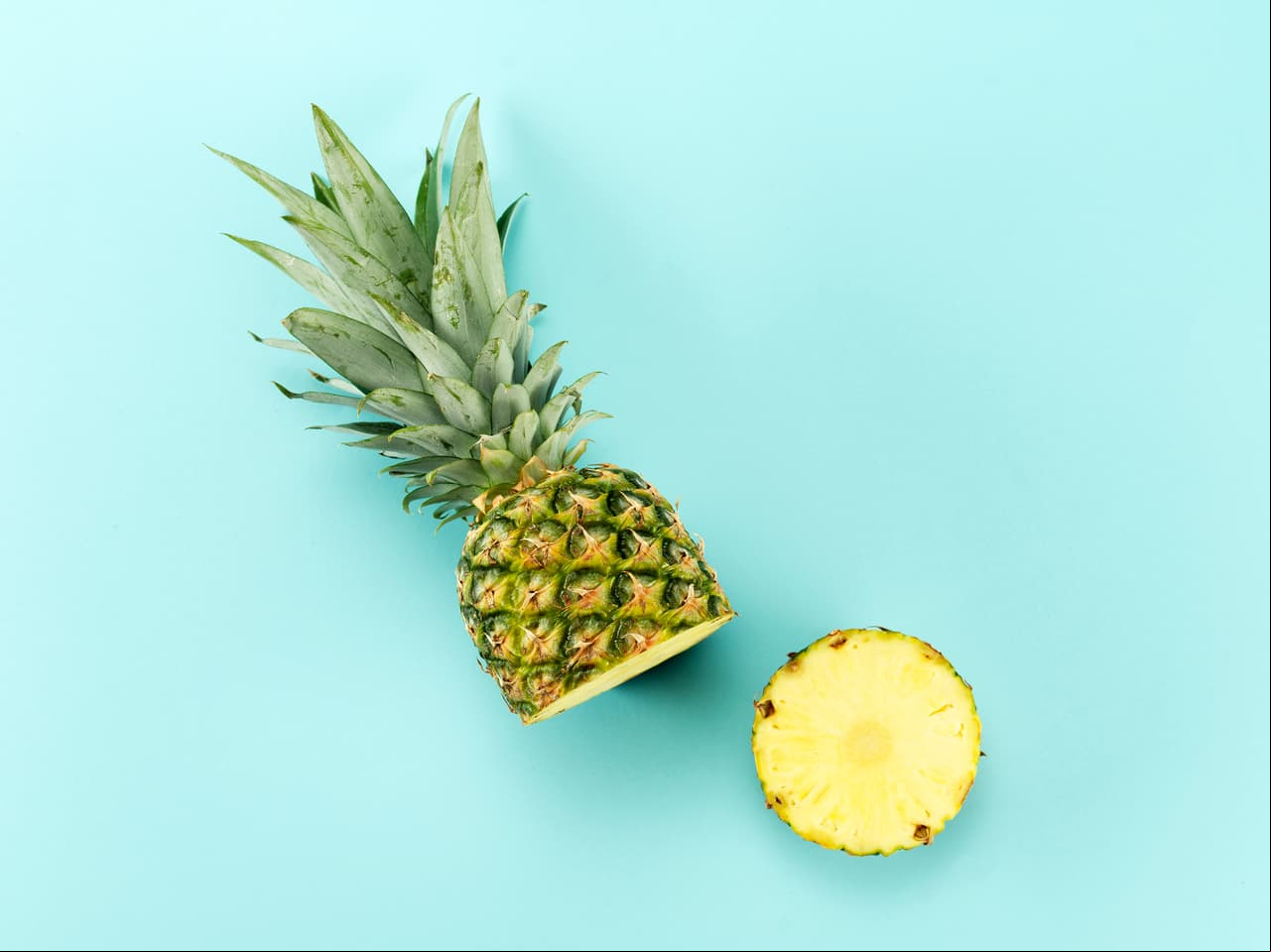 High angle view of a Halved Pineapple on blue background
