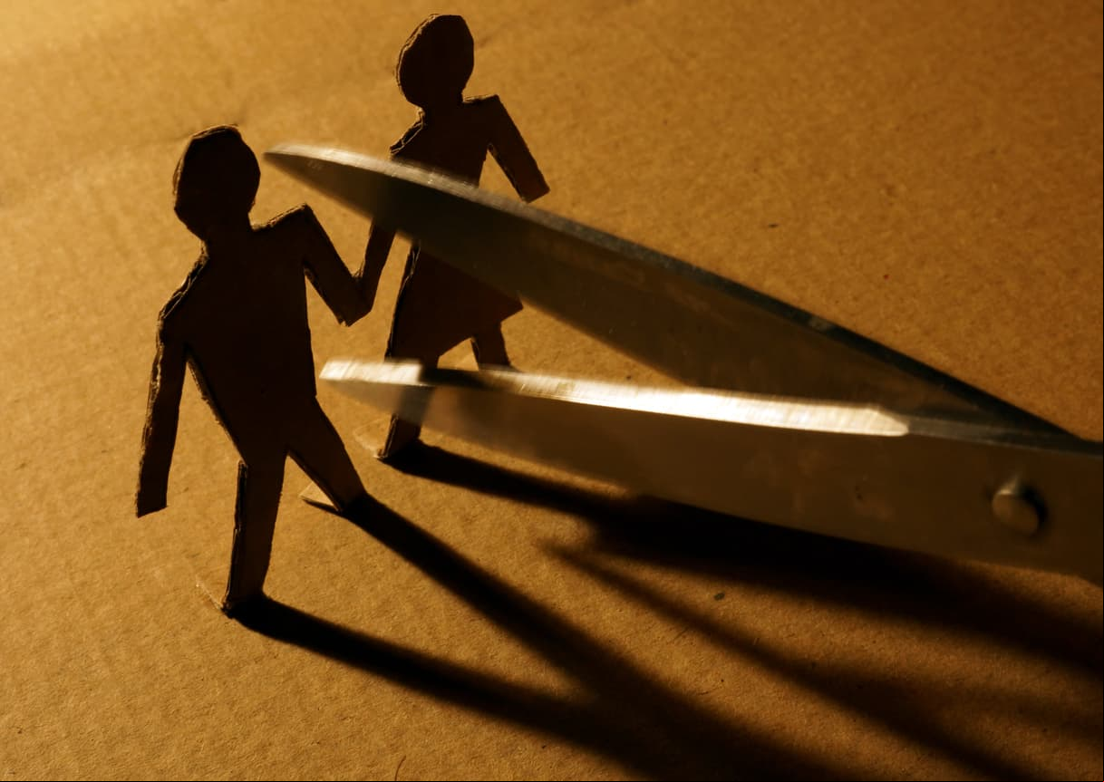 Figures of couple from paper and scissors.